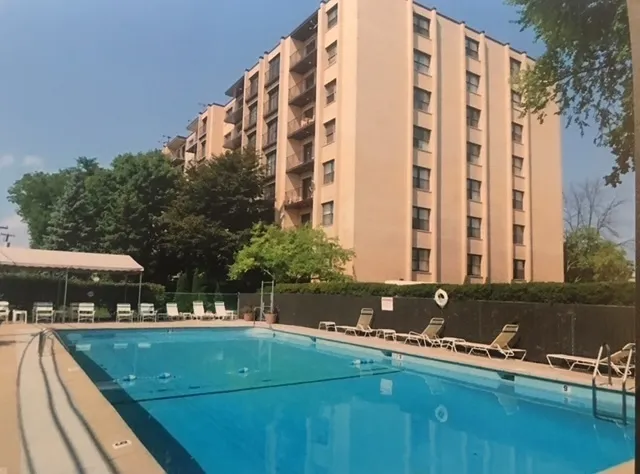a view of swimming pool with chairs