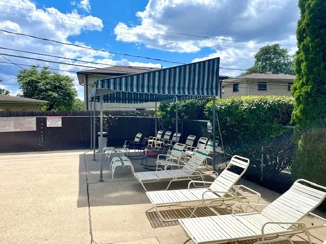 a view of a patio with a table chairs and a patio