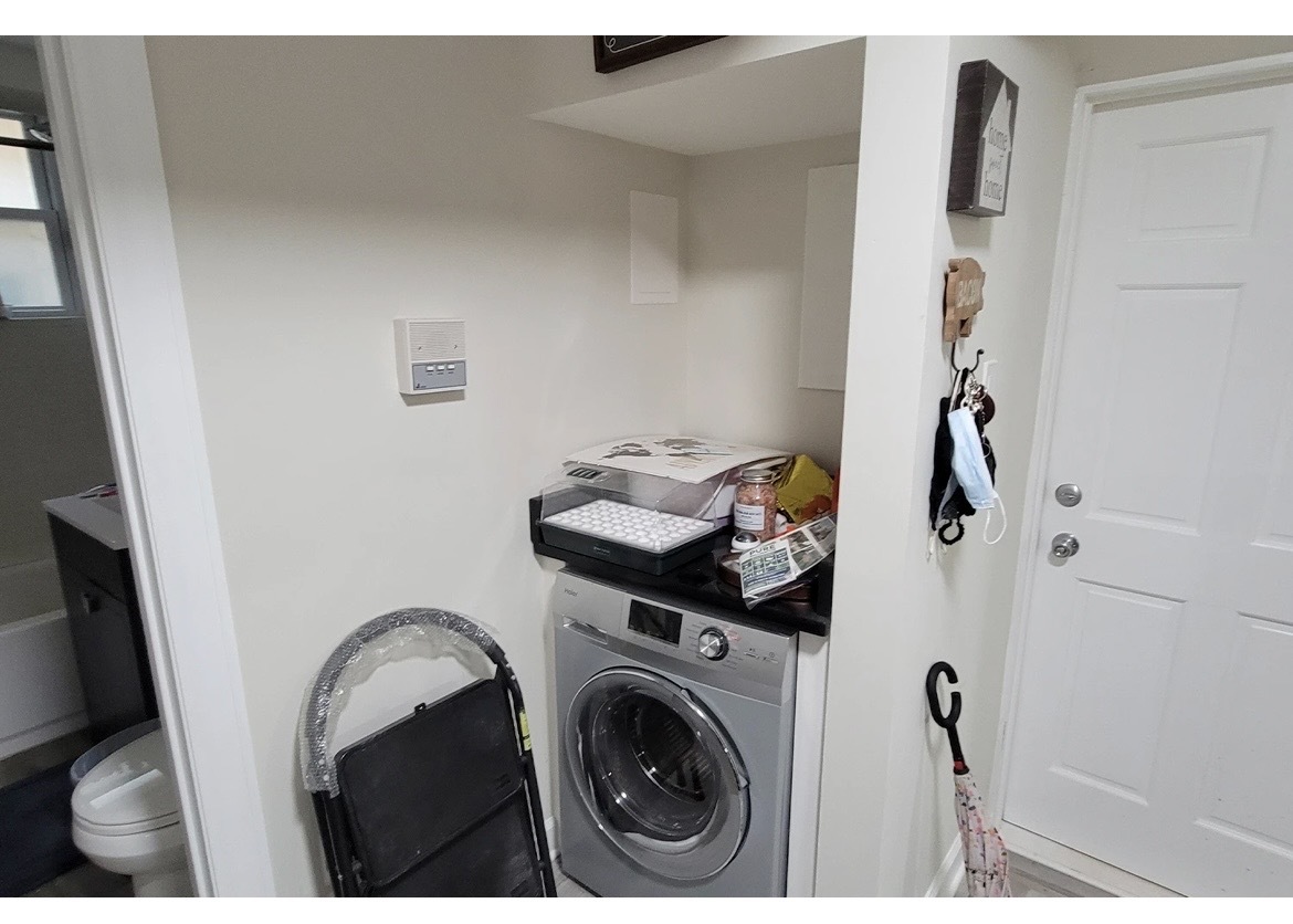 732 West Roscoe Street, Unit NGD Chicago, IL 60657 - Photo 6 of 8 a utility room with dryer and washer