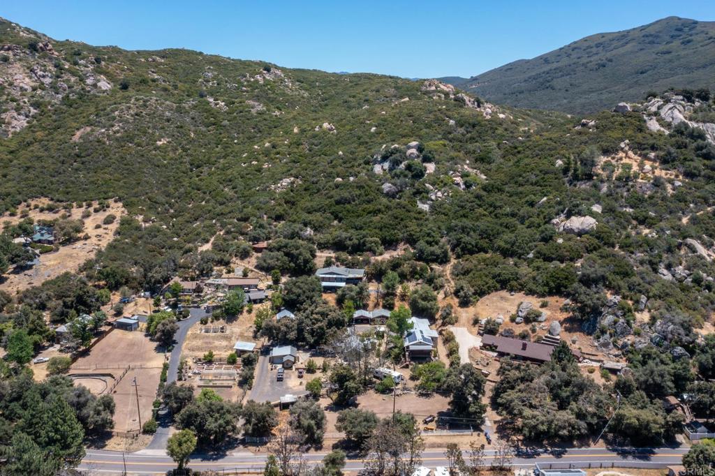 9727 Highway 79 Descanso, CA 91916 - Photo 1 of 1 an aerial view of residential houses with outdoor space and trees
