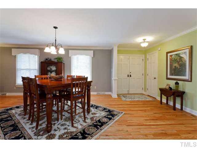 1605 Su John Road Raleigh, NC 27607 - Photo 4 of 25 a view of a dining room with furniture and chandelier