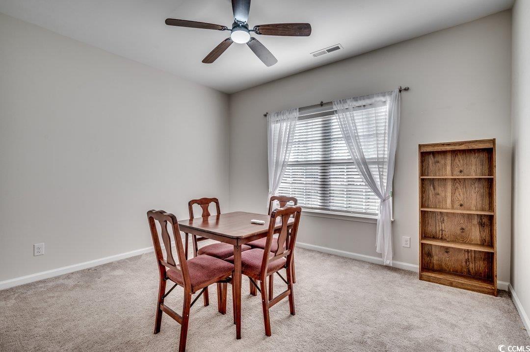 477 Cane Branch Road Loris, SC 29569 - Photo 20 of 27 Dining space featuring light colored carpet and ce