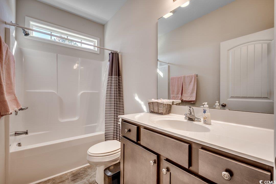 477 Cane Branch Road Loris, SC 29569 - Photo 21 of 27 Full bathroom featuring vanity, toilet, and shower