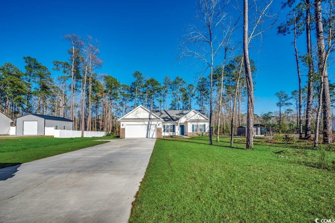 477 Cane Branch Road Loris, SC 29569 - Photo 26 of 27 Single story home with a garage and a front yard