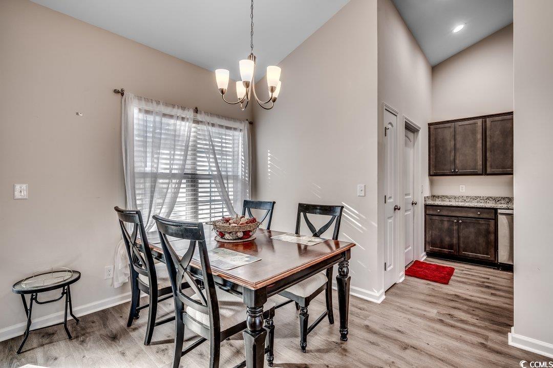 477 Cane Branch Road Loris, SC 29569 - Photo 5 of 27 Dining space with high vaulted ceiling, a chandeli