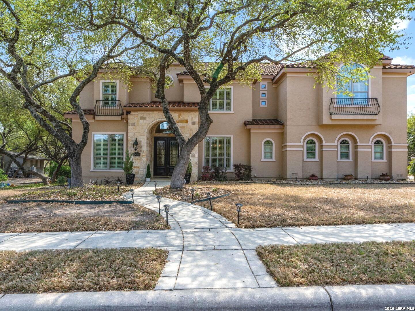 a front view of a house with a yard