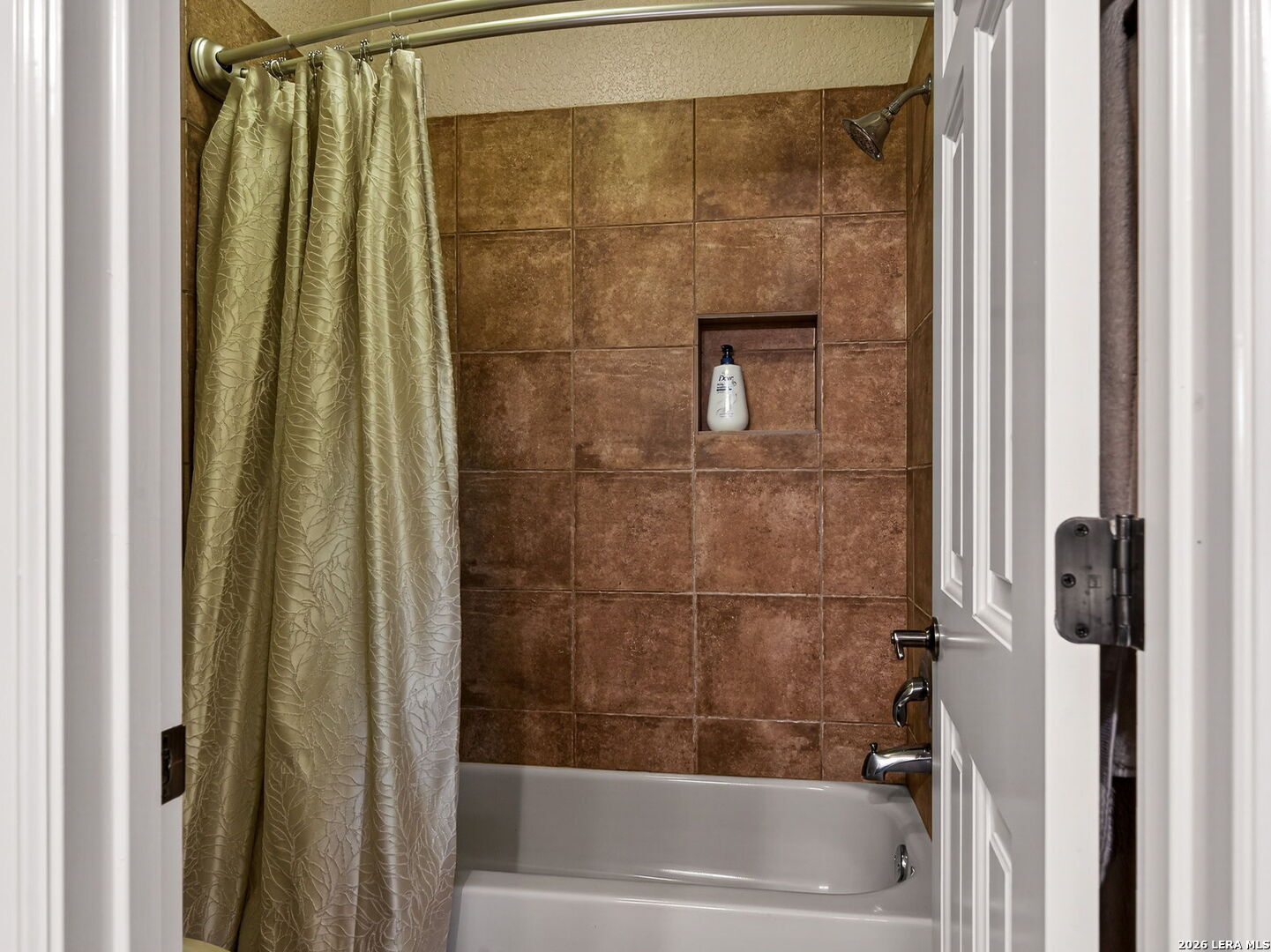 24511 Bogey Ridge San Antonio, TX 78258 - Photo 26 of 39 a bathroom with a shower and a tub