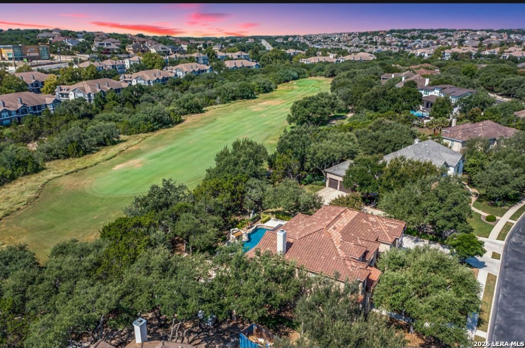 24511 Bogey Ridge San Antonio, TX 78258 - Photo 38 of 39 an aerial view of lake residential house with outdoor space and trees around