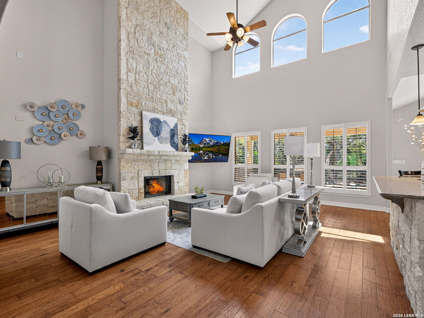 24511 Bogey Ridge San Antonio, TX 78258 - Photo 6 of 39 a living room with furniture and a fireplace