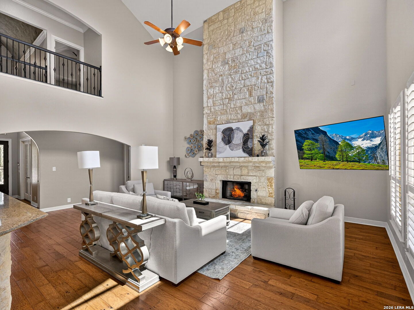 24511 Bogey Ridge San Antonio, TX 78258 - Photo 7 of 39 a living room with furniture and a fireplace