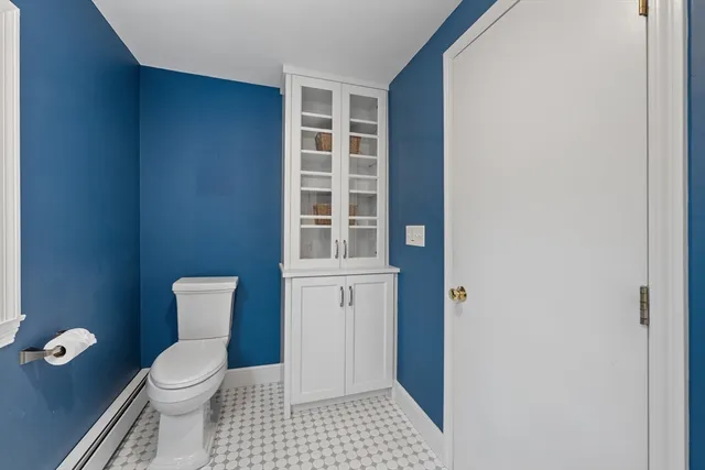 a living room with a couch and large windows