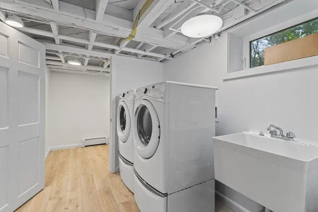 a bathroom with a toilet a sink and a window