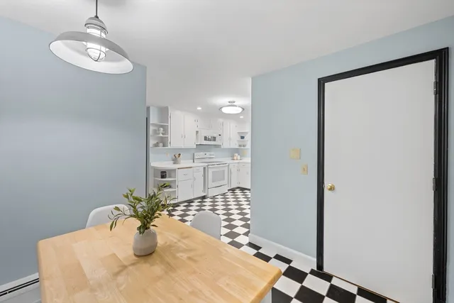 a view of a dining room with furniture window and outside view