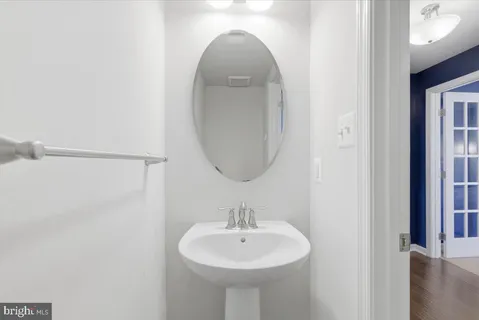 a bathroom with a sink a mirror and a shower