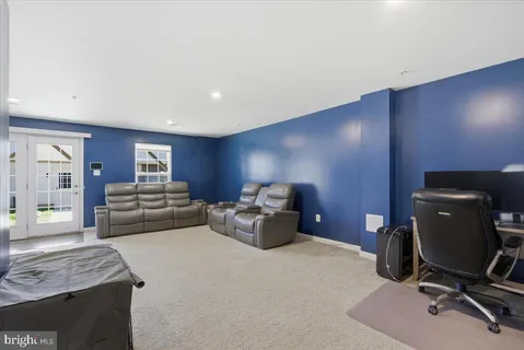 a work room with furniture and gym equipment