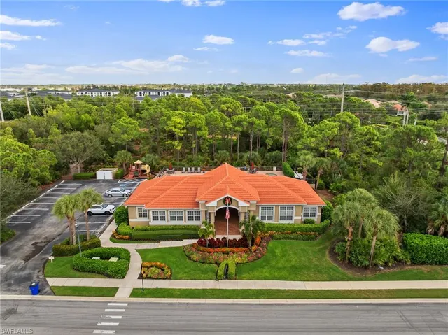 an aerial view of a house with a garden and yard