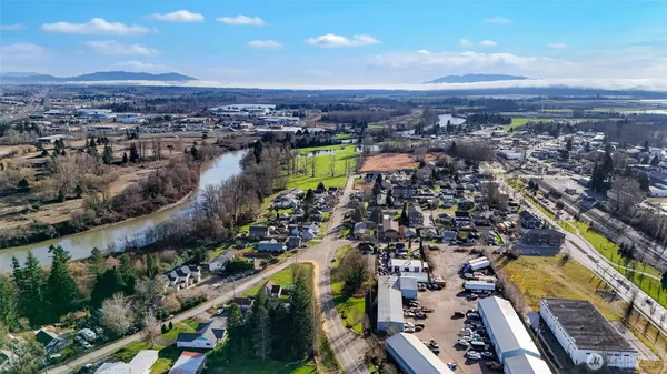 an aerial view of a house with a yard