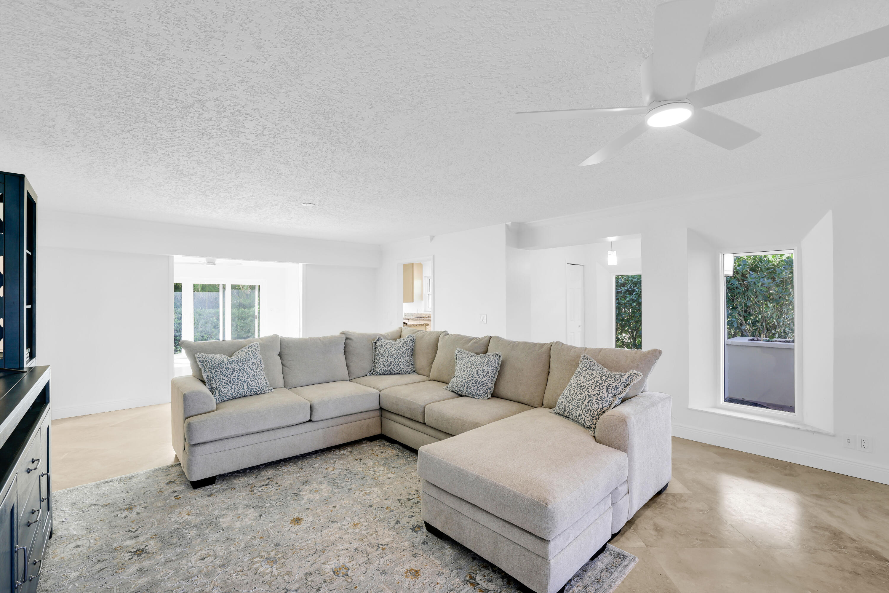 4161 U.S. Highway 1, Unit I2 Jupiter, FL 33477 - Photo 21 of 64 a living room with furniture and a large window