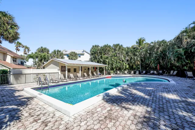 a bathroom with a granite countertop sink toilet and mirror