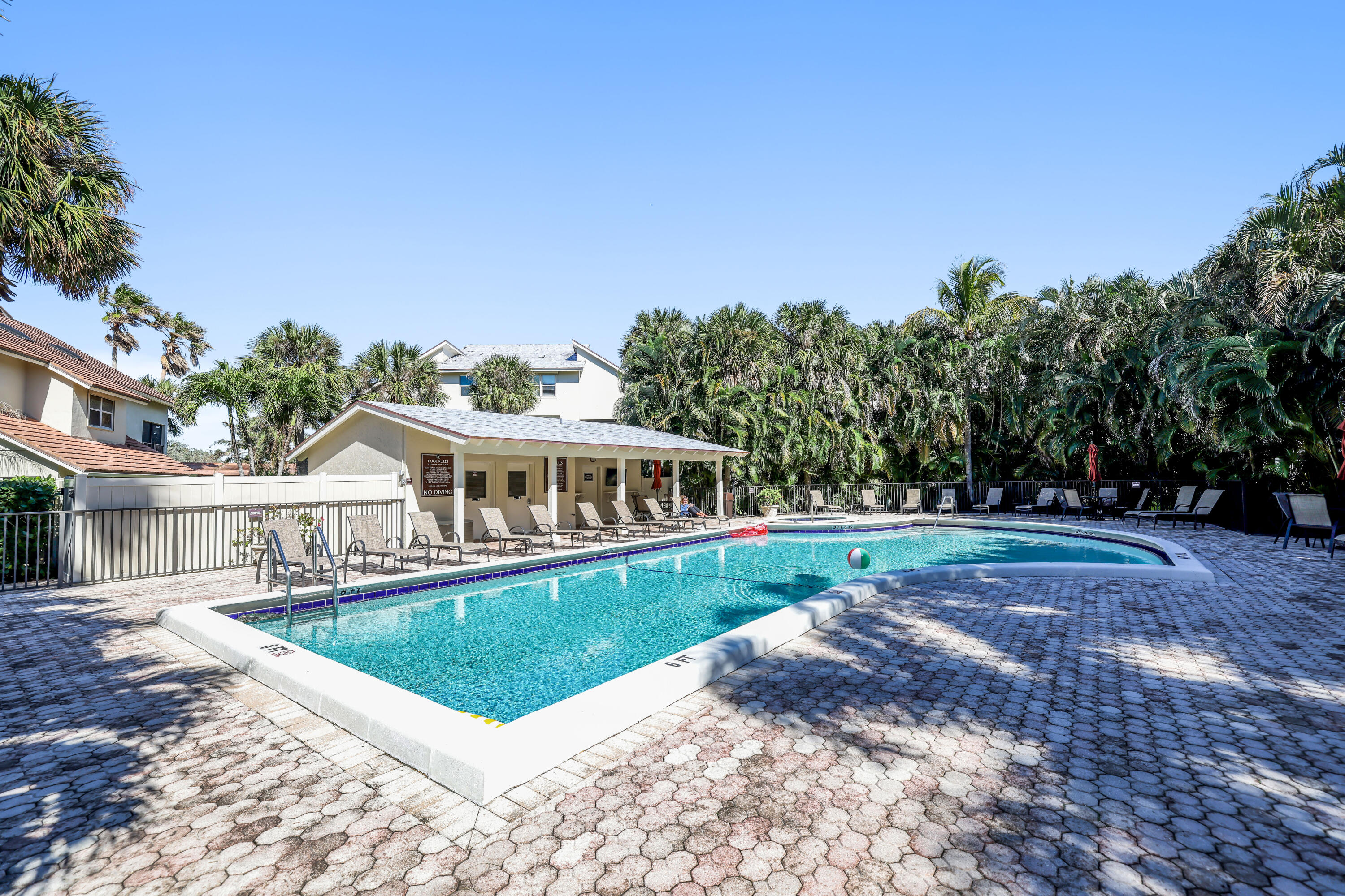 4161 U.S. Highway 1, Unit I2 Jupiter, FL 33477 - Photo 30 of 64 a view of a house with a big yard and large trees