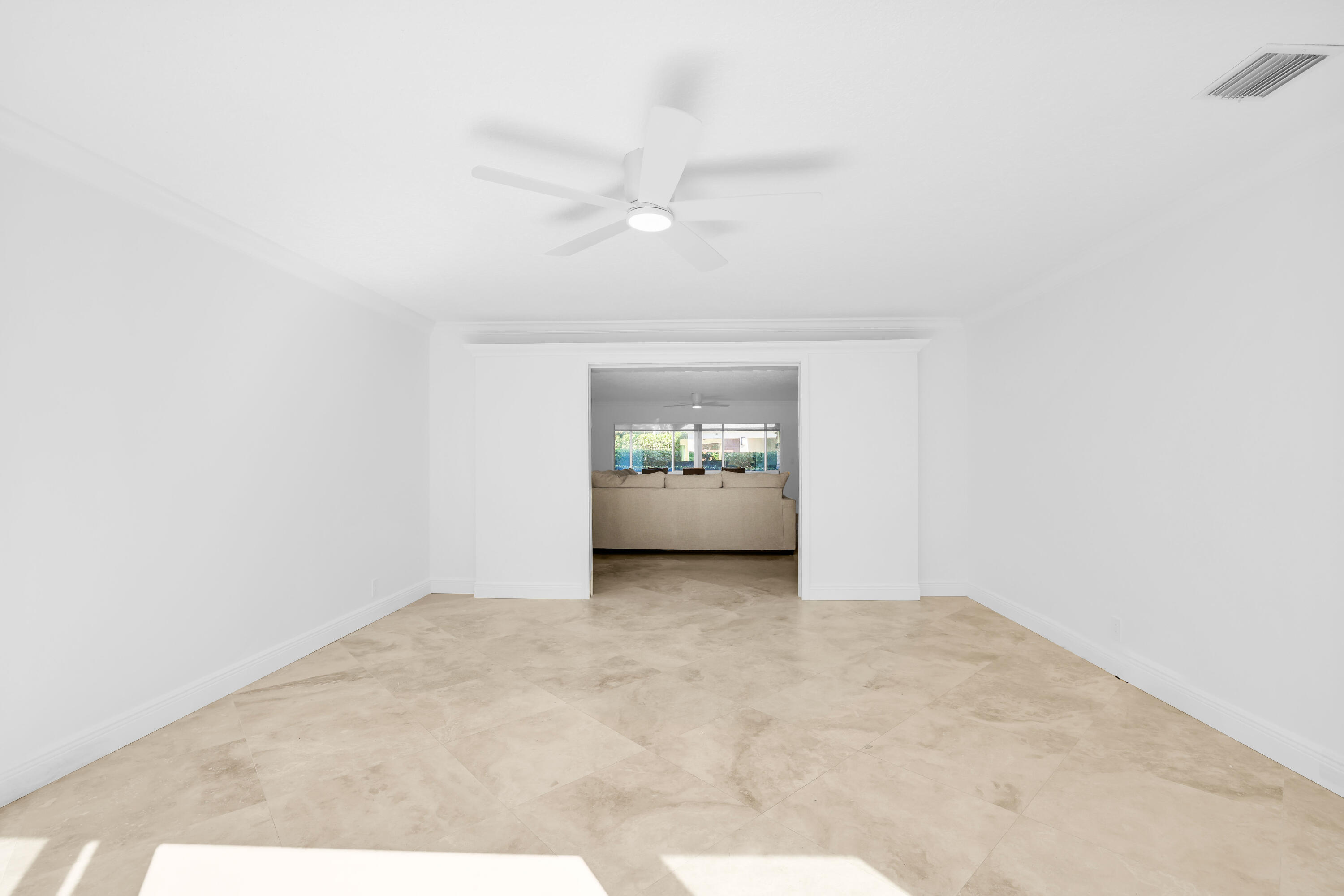 4161 U.S. Highway 1, Unit I2 Jupiter, FL 33477 - Photo 32 of 64 a view of an empty room with a window