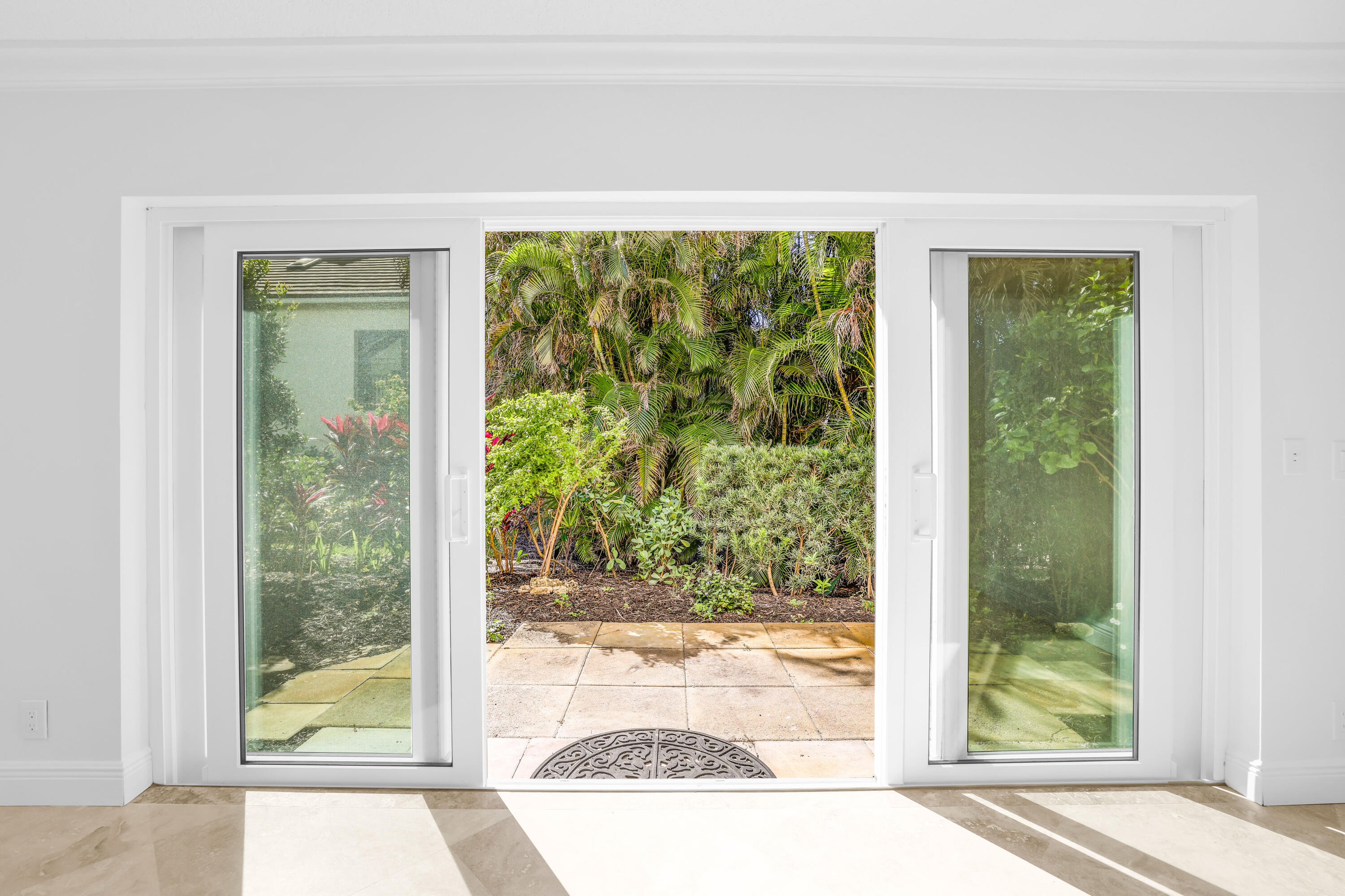 4161 U.S. Highway 1, Unit I2 Jupiter, FL 33477 - Photo 34 of 64 a view of a room that has a large window with front of yellow house