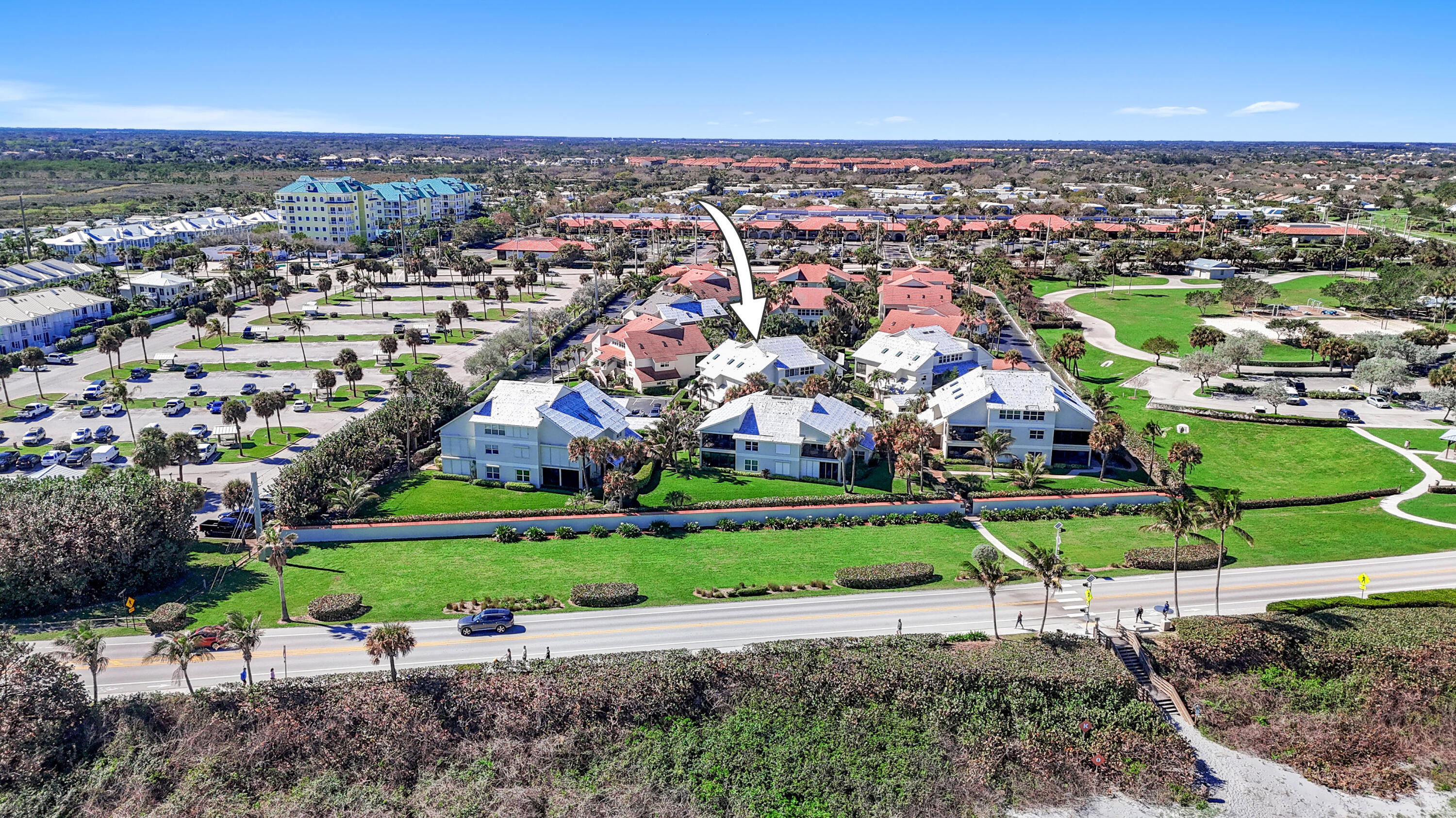 4161 U.S. Highway 1, Unit I2 Jupiter, FL 33477 - Photo 40 of 64 an aerial view of a city with lots of residential buildings and mountain view in back