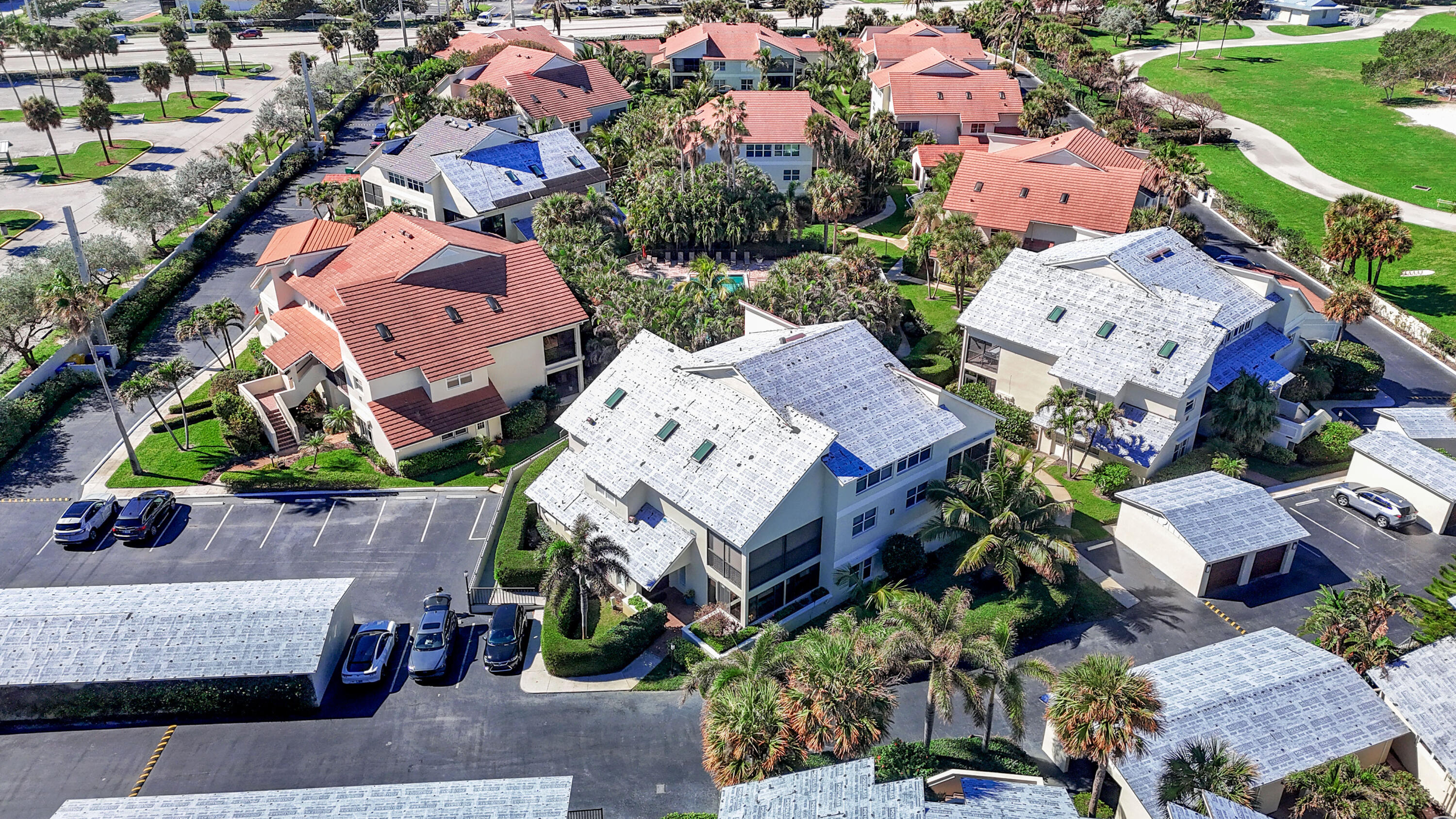 4161 U.S. Highway 1, Unit I2 Jupiter, FL 33477 - Photo 43 of 64 an aerial view of a house with yard swimming pool and outdoor seating