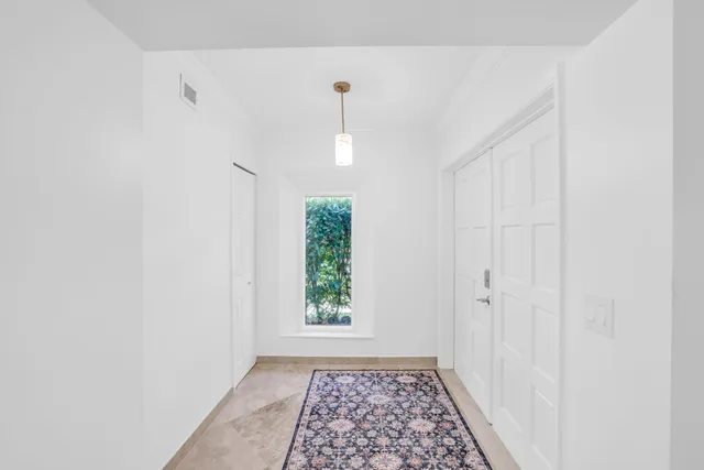 an aerial view of a building with an outdoor space and seating