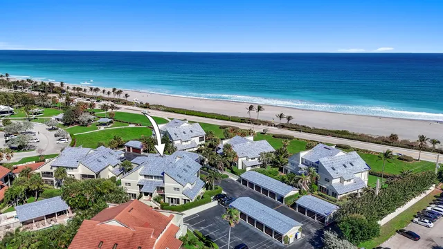 an aerial view of multiple houses with yard
