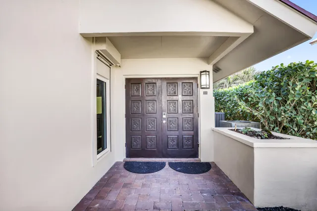a bathroom with a granite countertop sink mirror and double