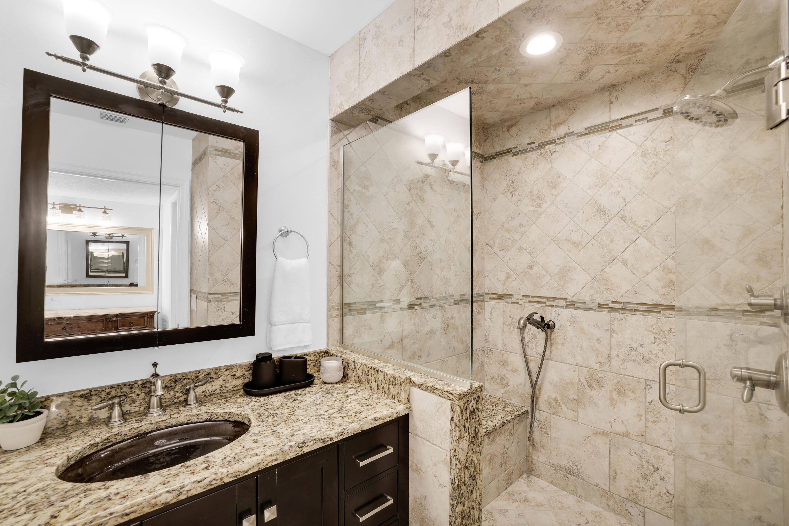 4161 U.S. Highway 1, Unit I2 Jupiter, FL 33477 - Photo 8 of 64 a bathroom with a granite countertop sink mirror and double