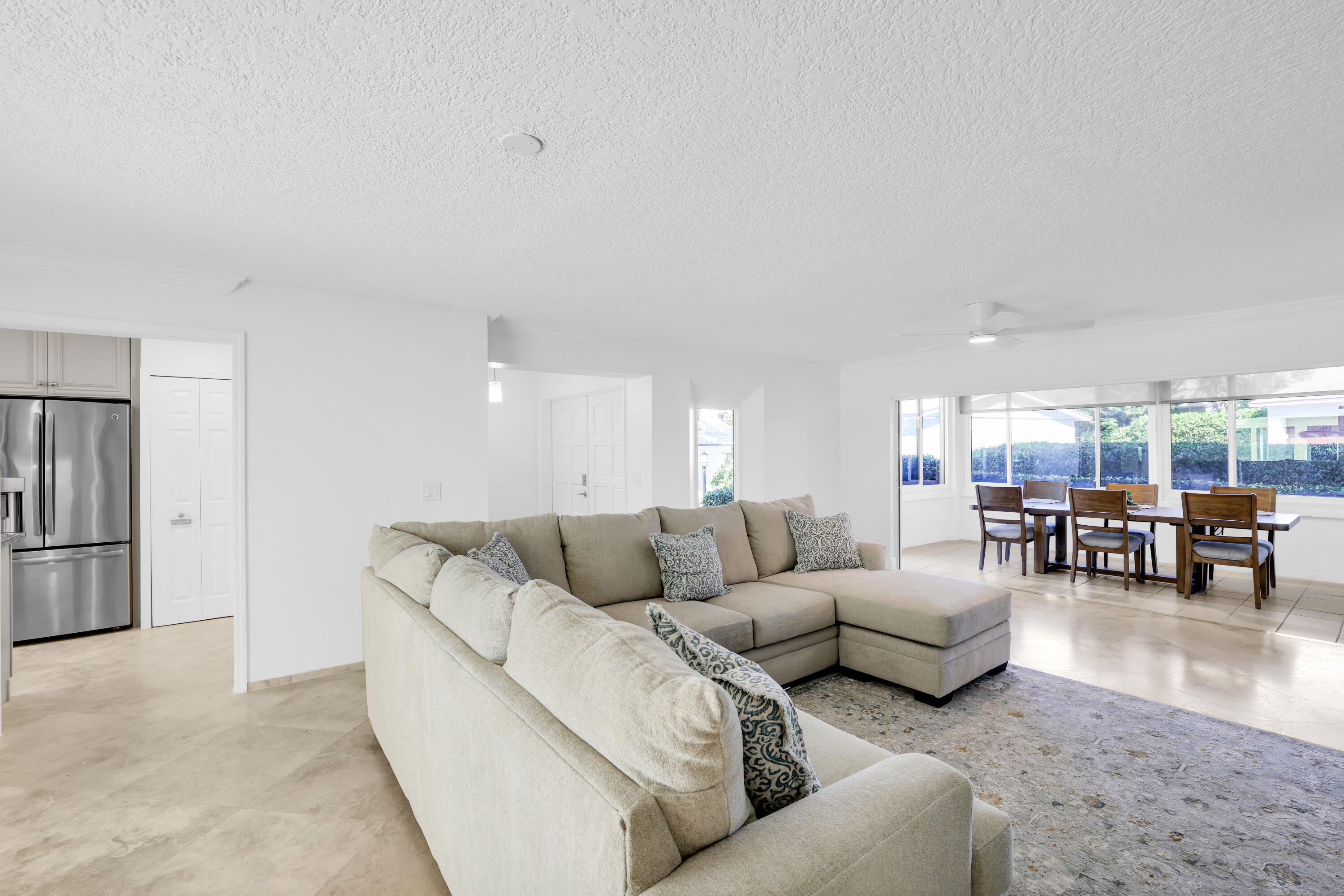 4161 U.S. Highway 1, Unit I2 Jupiter, FL 33477 - Photo 9 of 64 a living room with furniture and large window