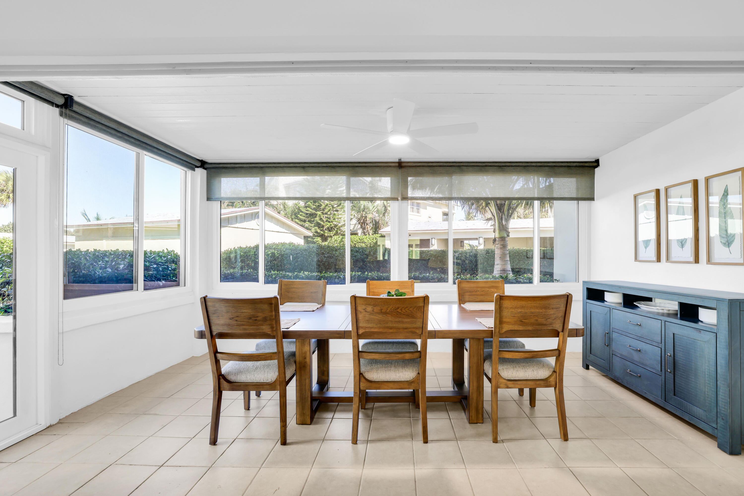 4161 U.S. Highway 1, Unit I2 Jupiter, FL 33477 - Photo 10 of 64 a view of a dining room with furniture large windows and wooden floor