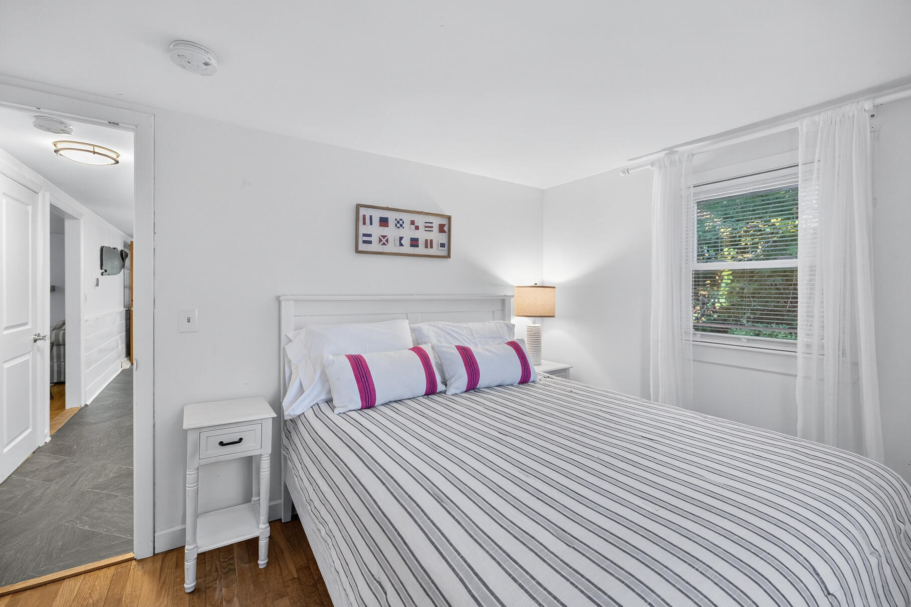 53 Main Street Sandwich, MA 02563 - Photo 12 of 33 a bedroom with a bed and a window