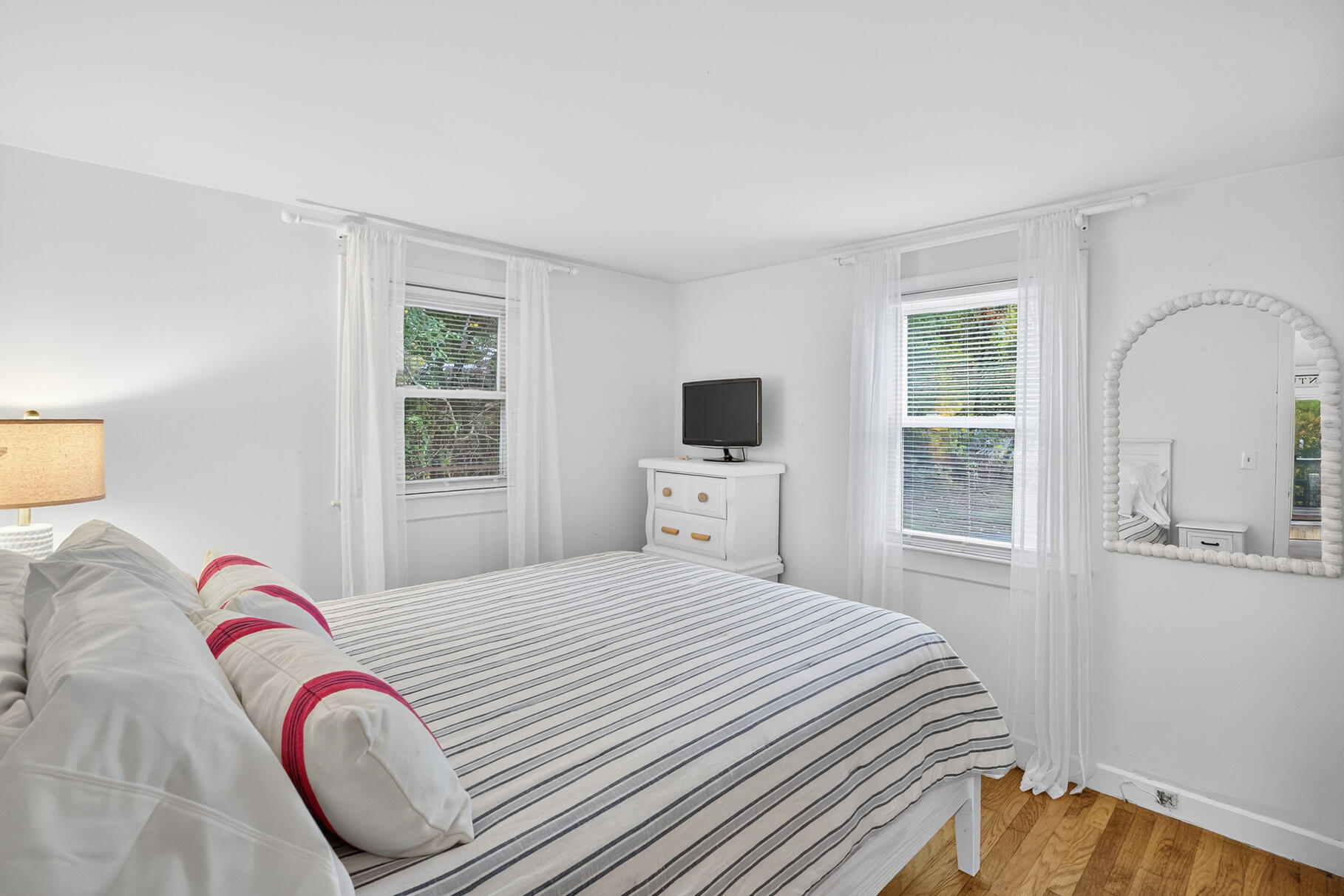 53 Main Street Sandwich, MA 02563 - Photo 13 of 33 a bedroom with a bed and a window