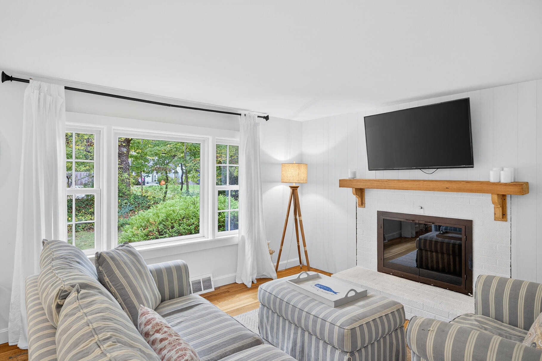 53 Main Street Sandwich, MA 02563 - Photo 14 of 33 a living room with furniture and a fireplace