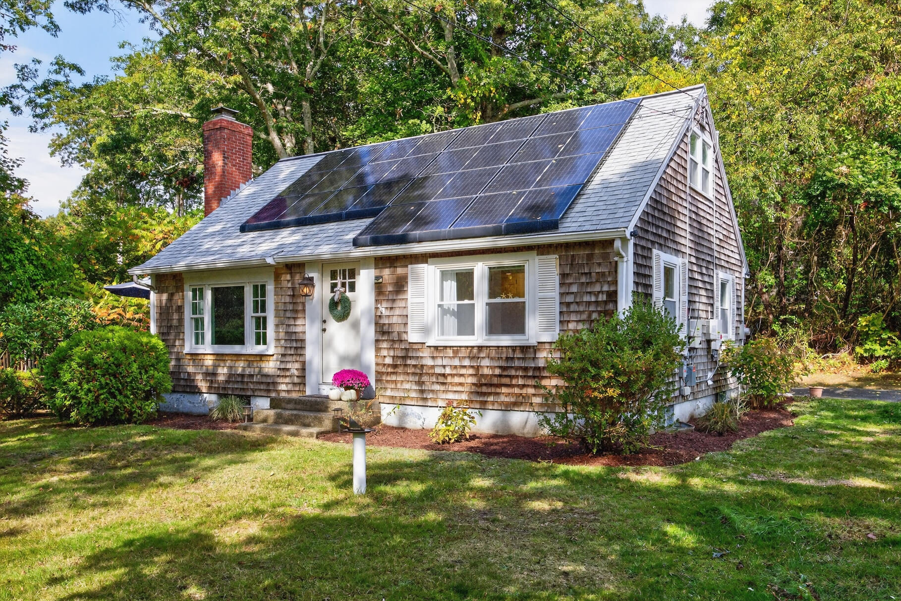 53 Main Street Sandwich, MA 02563 - Photo 21 of 33 a house view with a garden space
