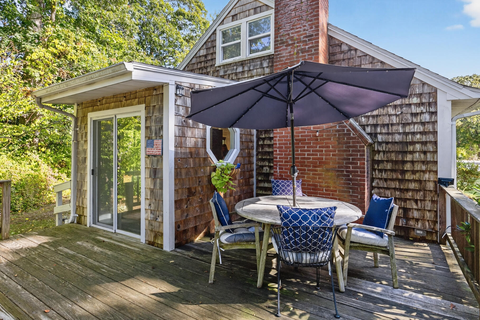 53 Main Street Sandwich, MA 02563 - Photo 24 of 33 a patio with table and chairs