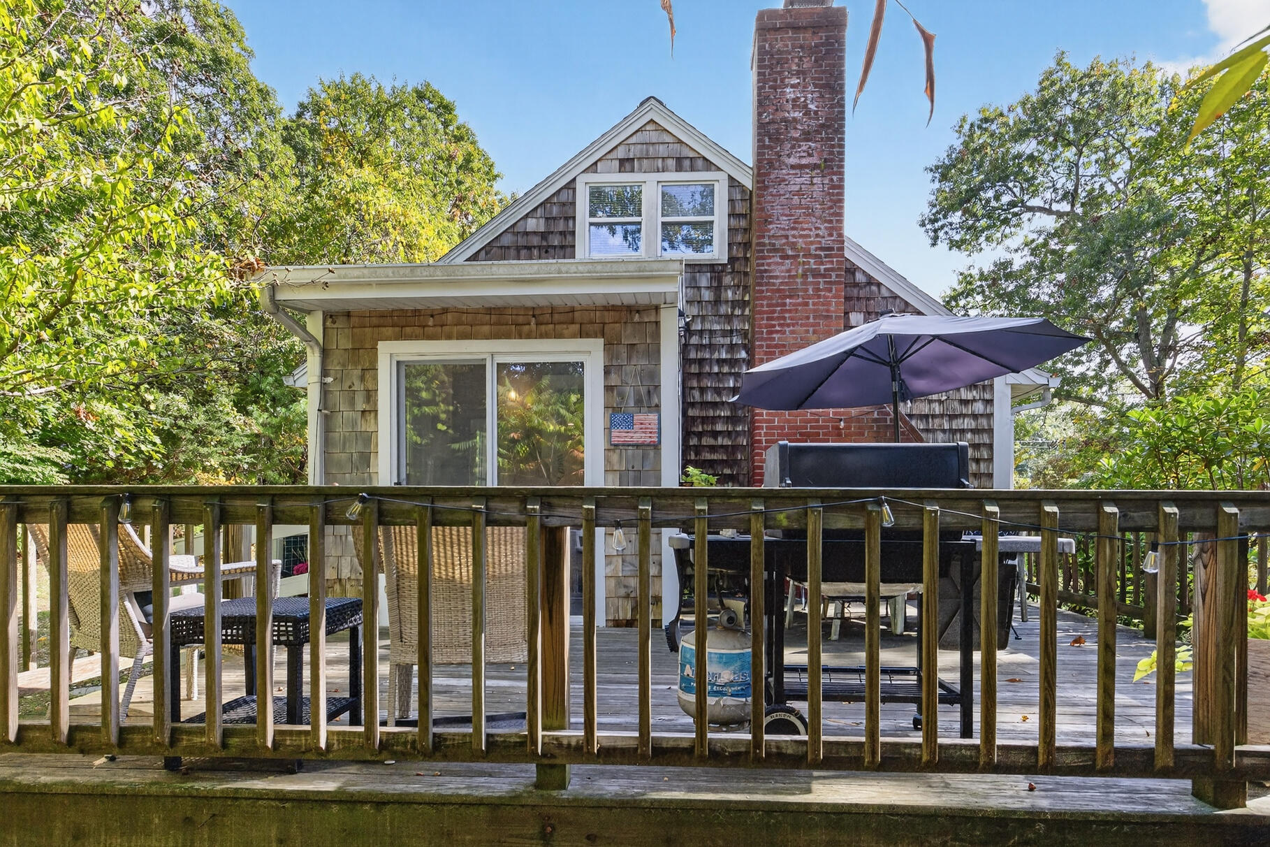 53 Main Street Sandwich, MA 02563 - Photo 25 of 33 a front view of a house with a yard