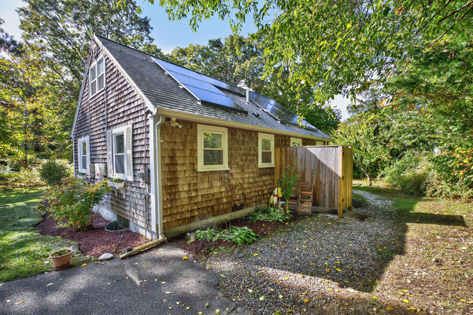 53 Main Street Sandwich, MA 02563 - Photo 27 of 33 a view of a house with a yard