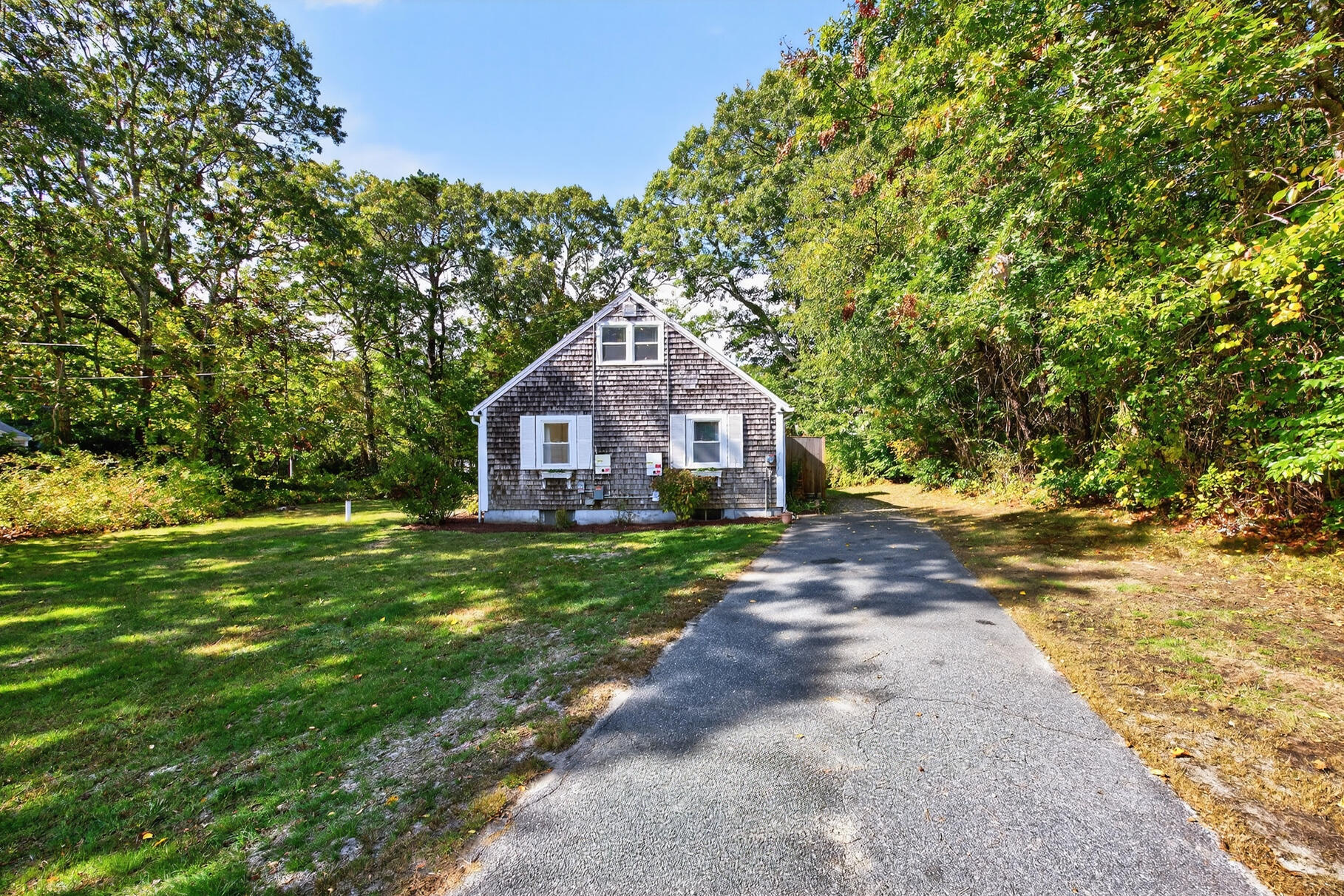 53 Main Street Sandwich, MA 02563 - Photo 28 of 33 a front view of a house with garden