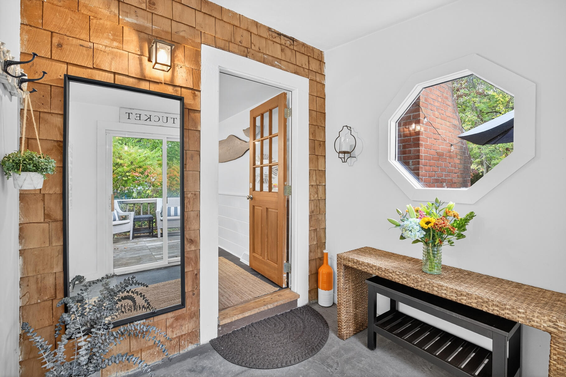 53 Main Street Sandwich, MA 02563 - Photo 8 of 33 a vase of flowers sitting on a floor in front of a door