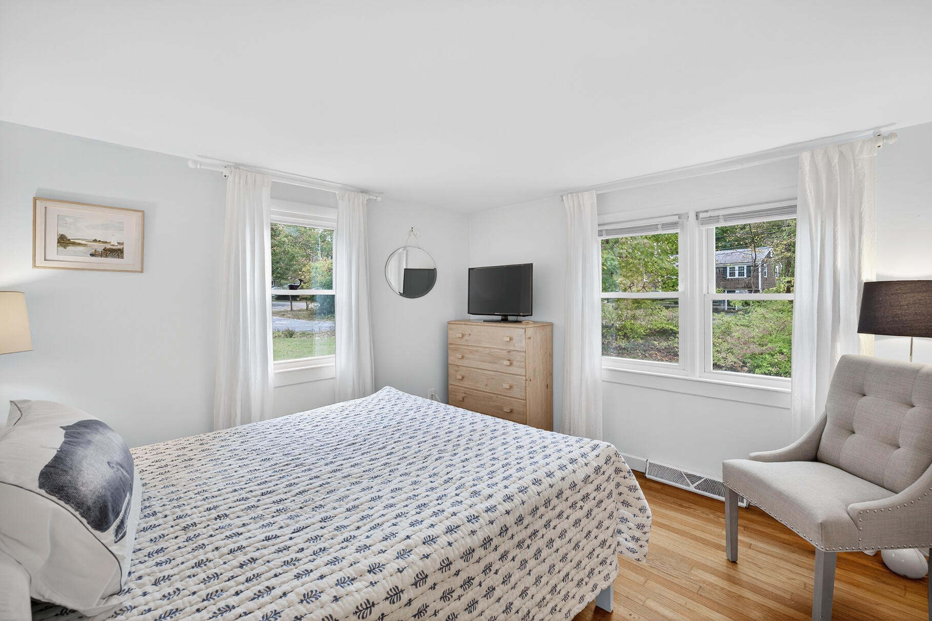 53 Main Street Sandwich, MA 02563 - Photo 10 of 33 a bedroom with a bed wooden floor and window