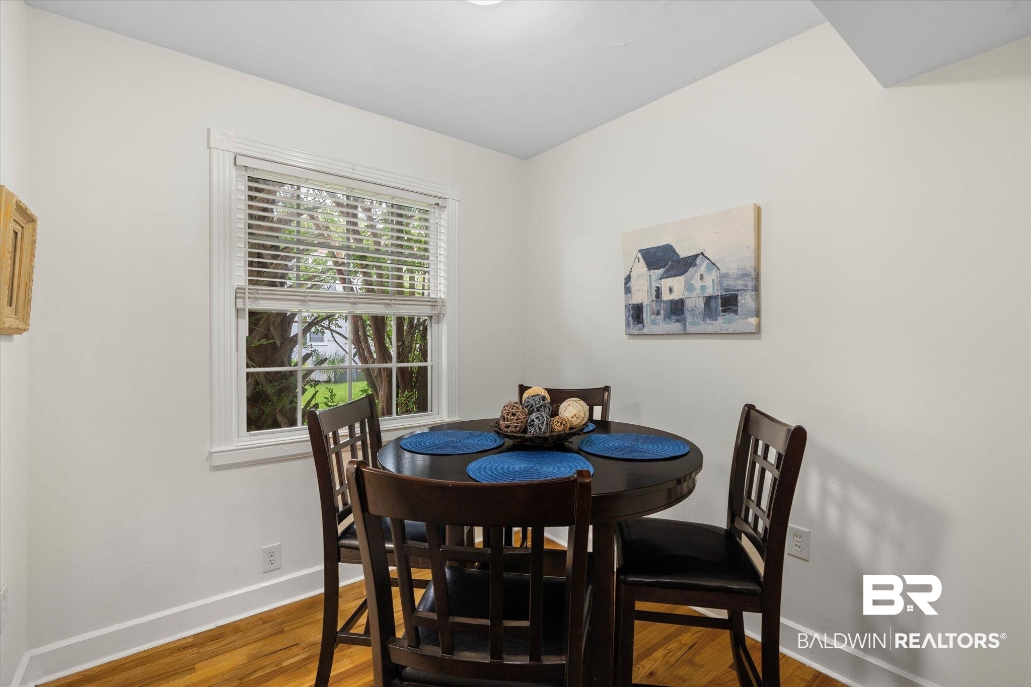 214 Upham Street, Unit 18A Mobile, AL 36607 - Photo 12 of 29 Dining room featuring baseboards and wood finished floors