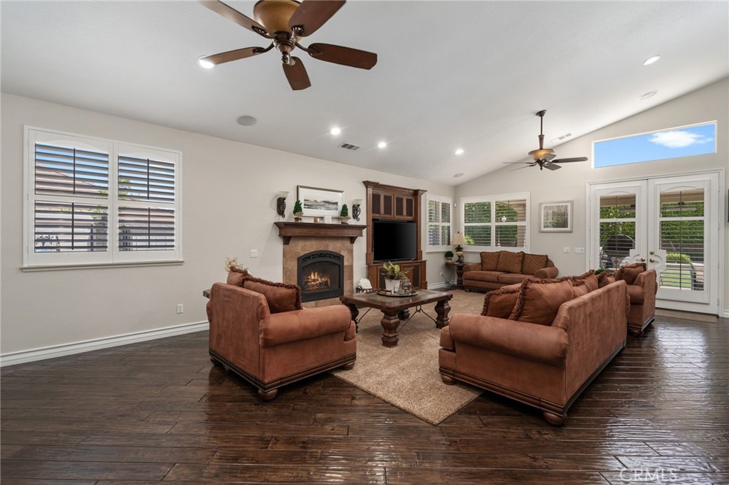 2885 Citrocado Ranch Street Corona, CA 92881 - Photo 11 of 51 a living room with furniture a fireplace and a window