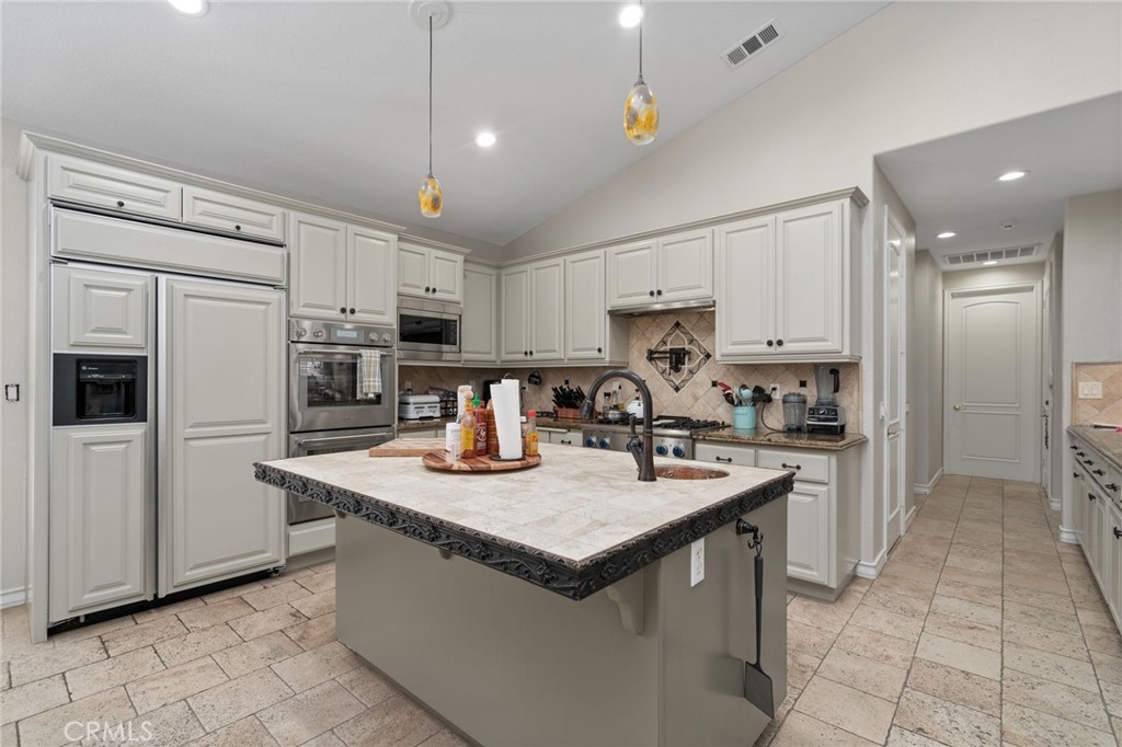 2885 Citrocado Ranch Street Corona, CA 92881 - Photo 18 of 51 a kitchen with stainless steel appliances granite countertop a sink dishwasher stove top oven and refrigerator