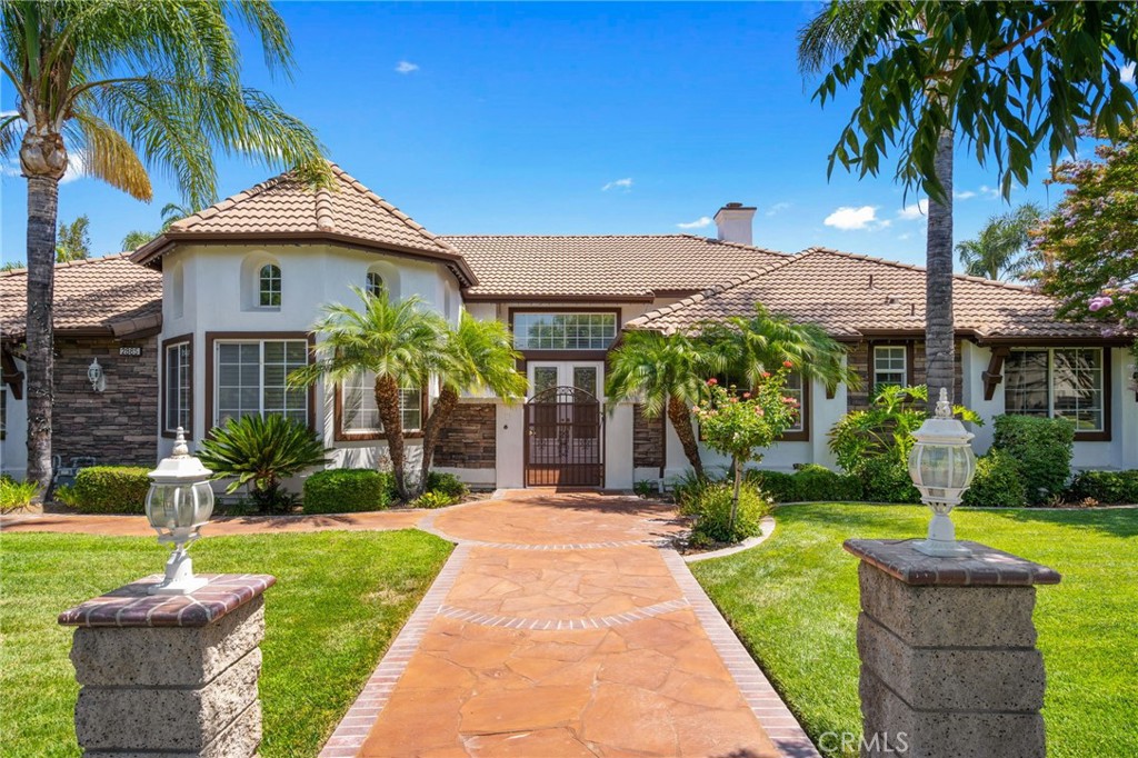 2885 Citrocado Ranch Street Corona, CA 92881 - Photo 2 of 51 a front view of house with yard and green space