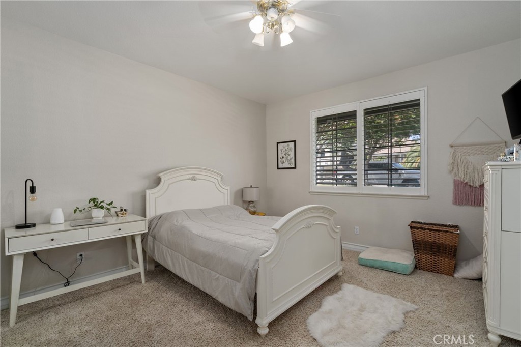 2885 Citrocado Ranch Street Corona, CA 92881 - Photo 22 of 51 a bedroom with a bed and a chandelier