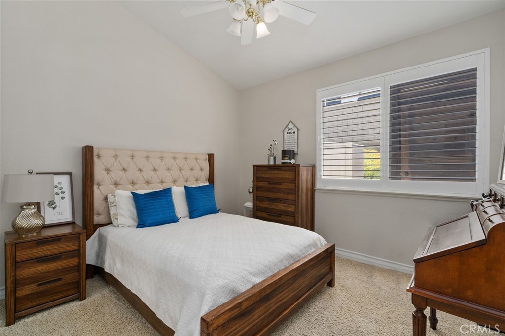 2885 Citrocado Ranch Street Corona, CA 92881 - Photo 23 of 51 a bedroom with a bed dresser and a window